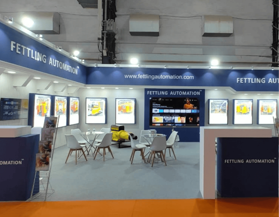 Fettling Automation exhibition booth with product displays